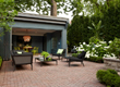 Interlocking brick sets a tone for this beautifully designed outdoor living space