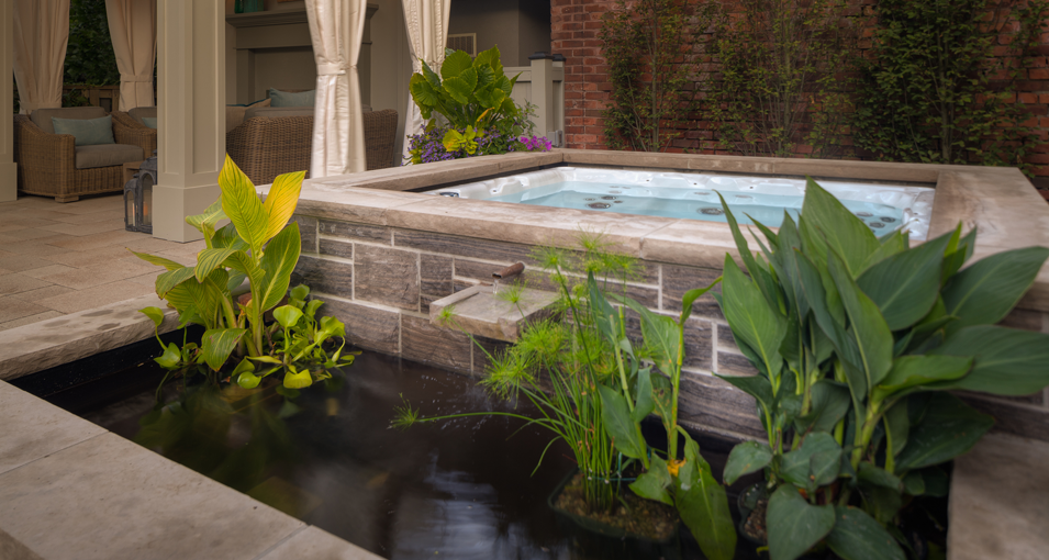 Photo slideshow of Artistic Gardens' design projects: long swimming pool with flagstone surround, privacy screen